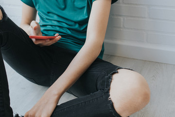 teen or young hands with mobile phone