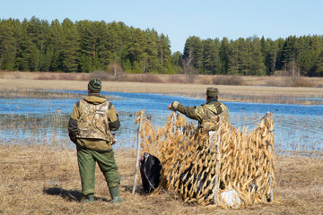 Hunting with a dog for ducks. Golden Retriever on the hunt.