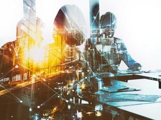 Silhouette of business people work together in office. Concept of teamwork and partnership. double exposure with network effects