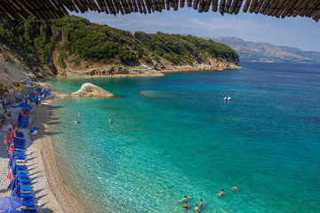 Obraz na płótnie Canvas Albania, ksamil -17 July 2018. Tourists are resting on the beach of the Ionian Sea