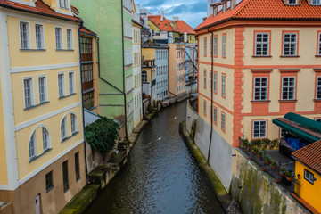Fototapeta na wymiar water channel with river of Certovka (Devil's Channel), also called Little Prague Venice, in district of Lesser Town (Mala Strana) Prague, Czech Republic, Europe