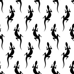 Seamless pattern with silhouettes of lizards. Australian animal. Isolated on white background.