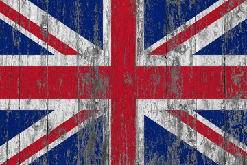 Flag of United Kingdom painted on worn out wooden texture background.