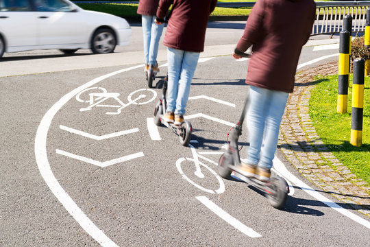 electric scooter in bicycle road lane line with traffic , multiple exposure