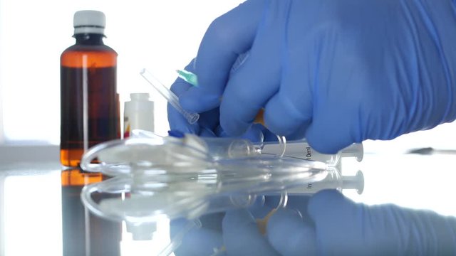 Medical Person Hands Protected with Gloves Checking Perfusion Needle