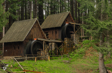 Wooden old mill in forest in valley near Zlate Hory town