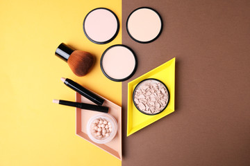Flat lay composition with various makeup products on color background