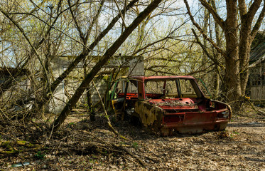 Old abandoned broken car. Exclusion zone of the Chernobyl nuclear disaster