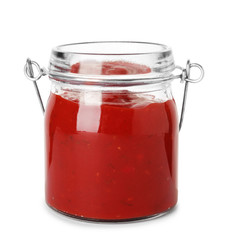 Glass jar with red sauce on white background