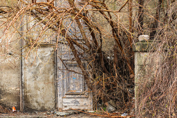 old abandoned building, scuffed and scraped the door and steps. top view. background