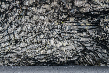 Basalt column of Reynisfjara, a world-famous black-sand beach found on the South Coast of Iceland.