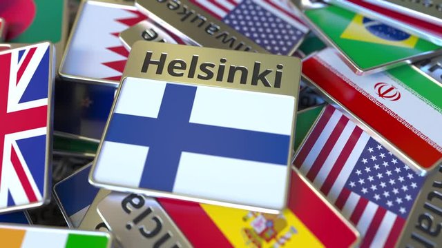 Souvenir magnet or badge with Helsinki text and national flag among different ones. Traveling to Finland conceptual intro animation