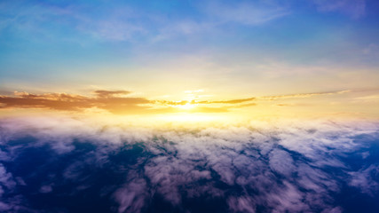 Beautiful sunset .  Beautiful heavenly landscape with the sun in the clouds . View of clouds from high altitude . Paradise heaven .light about the sky .