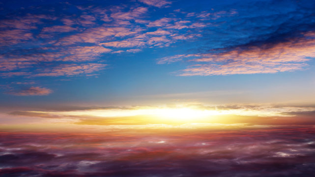 Beautiful sunset . Beautiful heavenly landscape with the sun in the clouds . View of clouds from high altitude . Paradise heaven .light about the sky . © yaalan