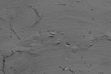 Wall fragment with scratches and cracks