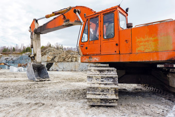 excavator in a marble quarry