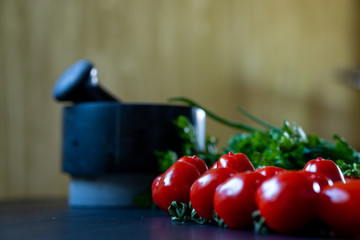 Close up shot of cherry tomatoes on the black table. Selective focus.