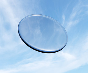 3d rendering of glass lens in front of cloudy sky