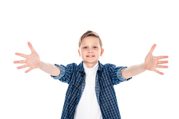 adorable smiling boy in casual clothes with outstretched hands isolated on white © LIGHTFIELD STUDIOS