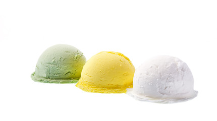 Three portions of different flavors of ice cream, green, yellow, white isolated on white background