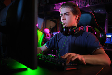 Cyber sport. Team play. Professional cybersport player training or playing online game on his PC