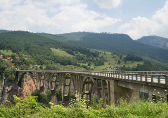 Fototapeta na wymiar Concrete arch Djurdjevica Tara bridge over the Tara River in Montenegro