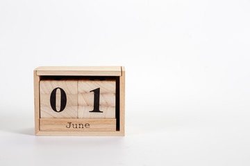 Wooden calendar June 01 on a white background