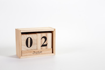 Wooden calendar June 02 on a white background