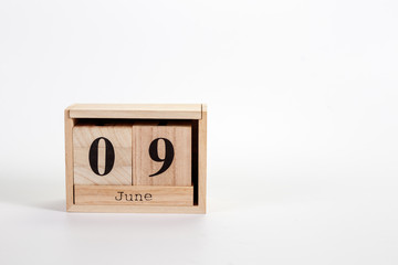 Wooden calendar June 09 on a white background