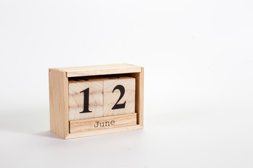 Wooden calendar June 12 on a white background