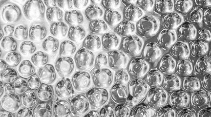 Shiny silver metal textured background with highlights and circles