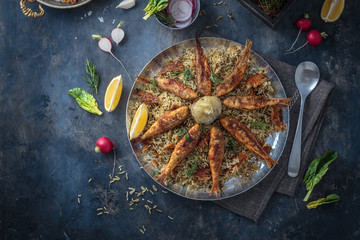 Herbed rice with fried fish, persian new year dish