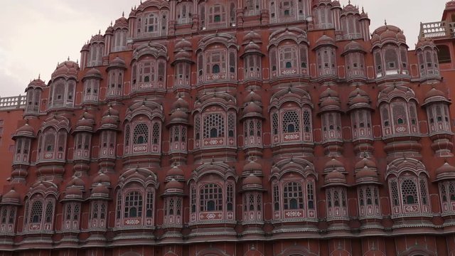 Front view tilting up the array of honeycomb windows on the Hawa Mahal palace in Jaipur, India