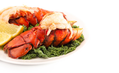 Broiled Lobster Tails on a Bed of Kale with Lemon Slices