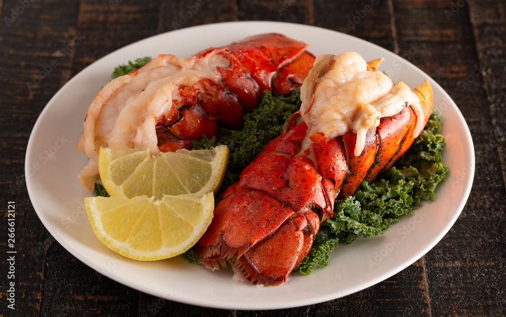 Wall mural Broiled Lobster Tails on a Bed of Kale with Lemon Slices