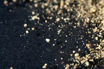 spice mix in best studio quality photographed partly isolated against black background with macro lens taken