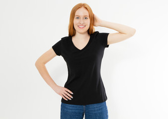 Fototapeta premium Beautiful red hair girl in a black t-shirt isolated on white. Pretty smile red head woman in tshirt mock up blank.
