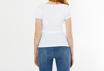 white t-shirt on a smiling girl : back view. Red hair woman with empty tshirt mock up