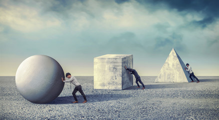 Businessman pushing the round large stone. Business heavy tasks and problems concept....