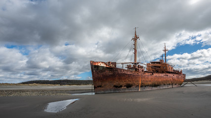 Huge aground boat on the beach