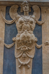Fototapeta na wymiar The exterior decoration of a building in Genoa