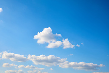 Naklejka na ściany i meble Air clouds in the blue sky