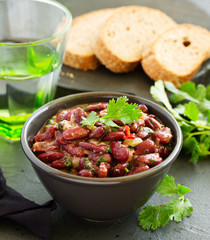 Stewed red beans with spices and cilantro, hot pepper. Lobio. Chile con carne.