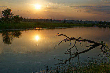 Colorful sunset over the river suburban area of central Russia.