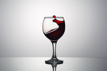 Splash and drops of red wine