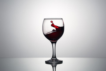 Splash and drops of red wine