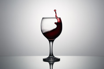 Splash and drops of red wine