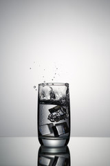 Glass of clean water with ice