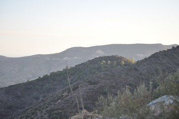 Obraz premium The beautiful natural mountain landscape in the Cyprus massif in the background at sunset