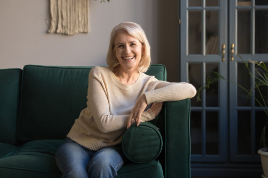 Portrait of smiling grey haired mature woman looking at camera